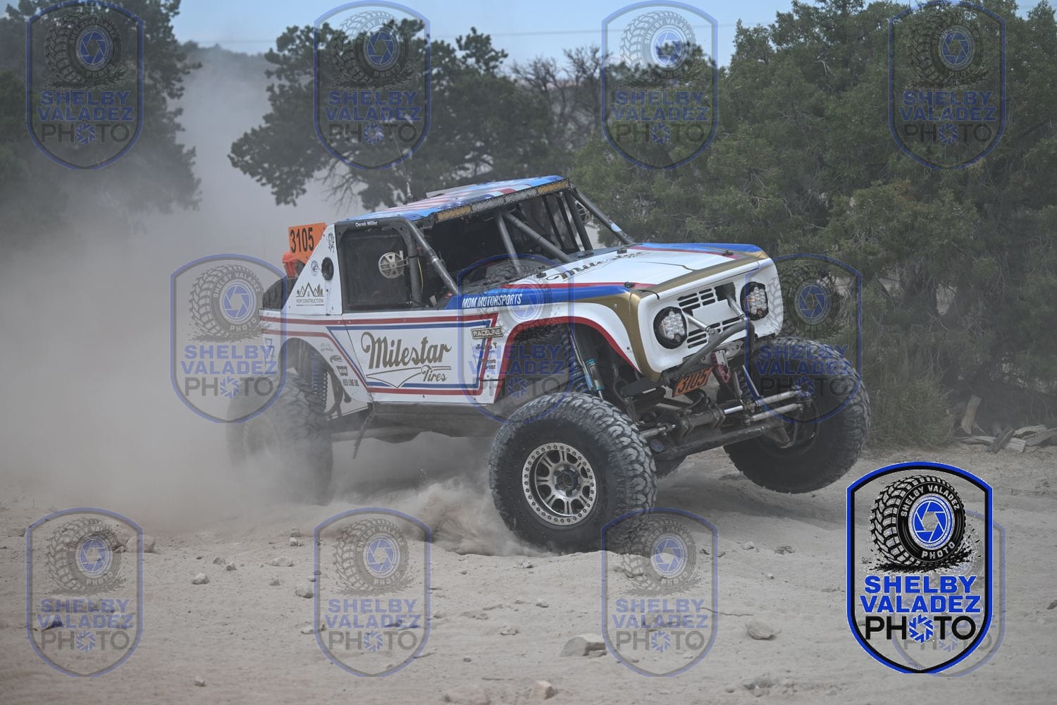 White Milestar Bronco racing through the high desert