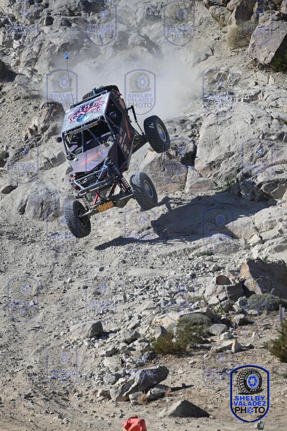 Ultra4 car catching big air over the rocks at King of the Hammers