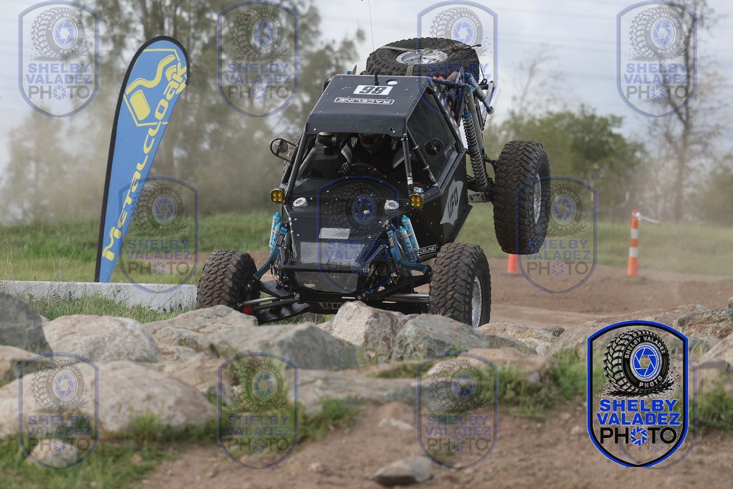 Black Ultra4 car crawling the rock section at Prairie City